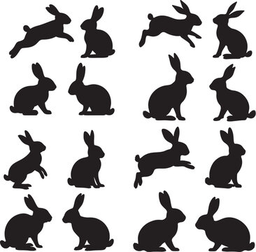 Set of silhouettes of rabbits sitting standing and jumping