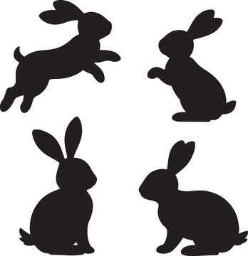 Set of silhouettes of rabbits sitting standing and jumping