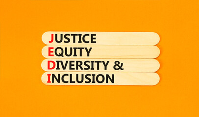 Wall Mural - Justice equity diversity inclusion symbol. Concept words JEDI Justice Equity Diversity Inclusion on sticks. Beautiful orange background. Business justice equity diversity inclusion concept. Copy space