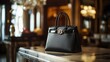 © xoan - Luxury black handbag on marble table, opulent background. Lifestyle photography for fashion websites
