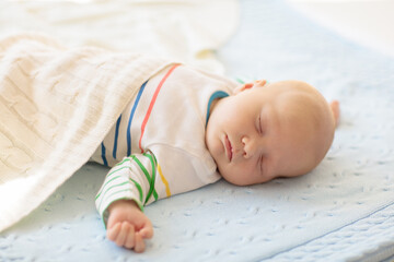 Wall Mural - Little baby on white bed