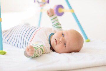 Wall Mural - Little baby on white bed