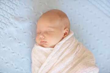 Wall Mural - Little baby on white bed