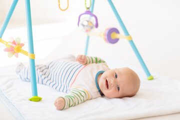 Wall Mural - Little baby on white bed