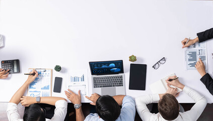 Fototapete - Group of office worker and businesspeople working on business financial data analysis. Empty space with editable blank background meeting table for customer design. Prudent