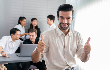 Aufkleber - Confidence and happy smiling businessman portrait with background of his colleague and business team working in office. Office worker teamwork and positive workplace concept. Prudent