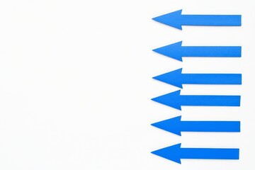 Poster - An arrangement of blue arrows dynamically oriented in various ways, signifying movement and direction
