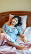 © Lola - Asian young beautiful girl sleeping with happiness in bedroom at home, retro style. with white shades