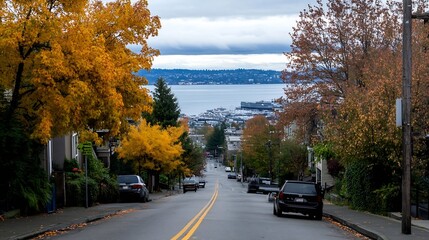 Poster - Scenic autumn landscape with vibrant fall foliage and a view of a waterfront city : Generative AI