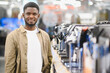© Serhii - Man choosing coffee machine in mall