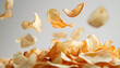 © Oleksiy - Flying potato chips isolated on white background with golden crisp texture