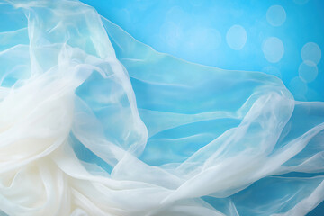 Poster - Elegant white fabric drapes softly against a serene blue background with light effects