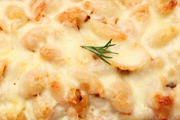 Wall Mural - Tasty baked pasta with rosemary and cheese as background, closeup