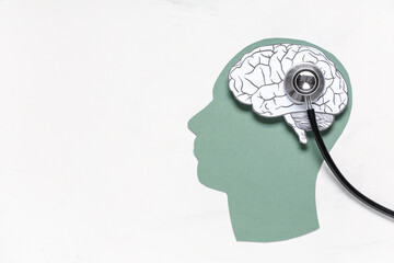 Wall Mural - Paper human head with brain and stethoscope on white background. Cancer concept