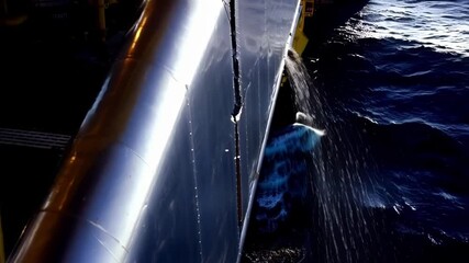 Poster - clean water cascading from offshore platform discharge pipe, forming mesmerizing fluid patterns agai