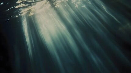 Poster - Captivating light beams pierce through the serene azure depths of the ocean creating an ethereal and mesmerizing underwater landscape  The diffuse