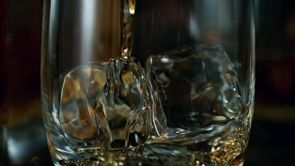 Canvas Print - Super Slow Motion of Pouring Whiskey into Glass. Filmed on High Speed Cinema Camera, 1000 fps. Macro shot.