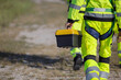 © charnsitr - engineer hand holding toolbox at wind turbine field