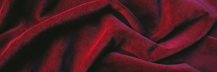 Poster - Burgundy suede fabric with rich color and subtle sheen illuminated by warm lighting