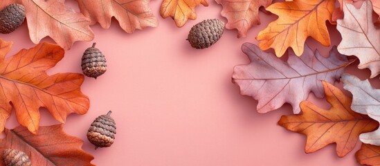 Leinwandbilder - Autumn composition featuring dried oak leaves in orange and beige tones with acorns arranged on a pastel pink background providing ample copy space.