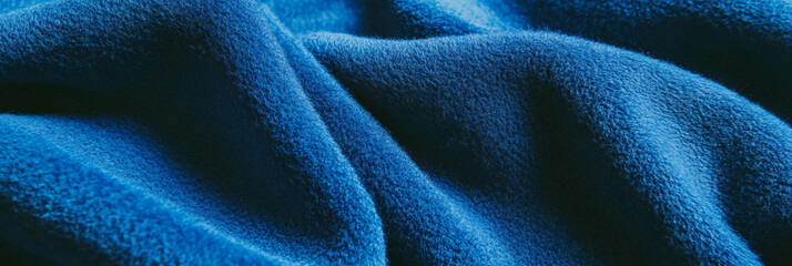 Aufkleber - Deep blue suede fabric showcasing smooth texture and subtle highlights under side lighting