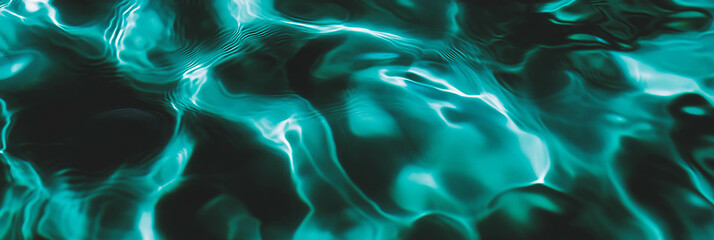 Poster - Deep turquoise water with ripples and shadows creating a mesmerizing backdrop