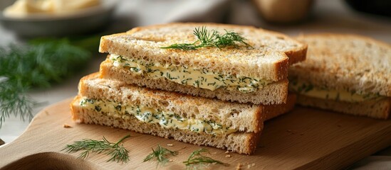 Poster - Cereal bread sandwiches with butter and fresh dill on a wooden cutting board with a blurred dining setting in the background.