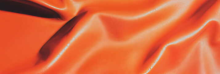 Poster - Rust orange leather textured fabric background with warm lighting for creative projects