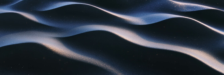 Poster - Black sand dune features gentle curves with smooth, wind-sculpted texture under soft light