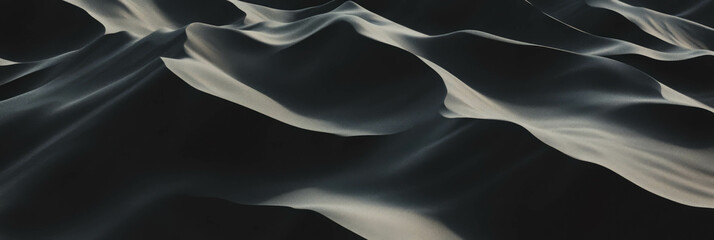 Poster - Black sand dune landscape with steep slopes and dramatic shadows at sunset