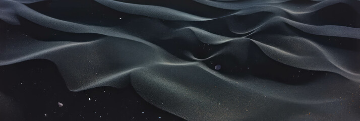 Aufkleber - Black sand texture with smooth pebbles creating a unique landscape in nature