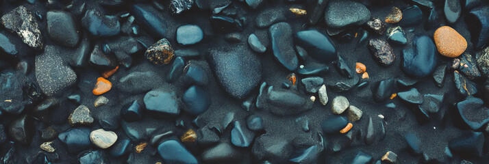 Poster - Exploring the unique texture of black sand with dark pebbles along the shore