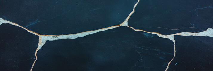 Poster - Cracked black wall texture with light grey details enhancing the visual depth