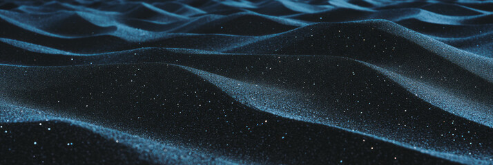Poster - Compacted black sand texture with subtle tire tracks under soft lighting at a shoreline