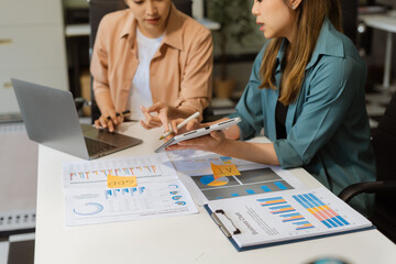 Wall Mural - Business people discussing on performance revenue in meeting. businessman working with co-worker team. financial adviser analyzing data with investor at office.