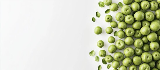 Poster - Green Granny Smith apples scattered on a white background with a top view perspective creating a fresh and vibrant composition