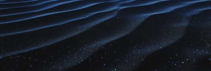 Poster - Fine black sand ripples create a unique texture in a tranquil, low-contrast landscape