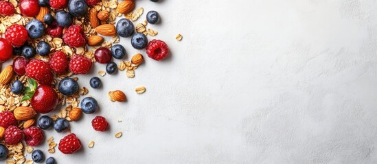Aufkleber - Colorful assortment of mixed berries and nuts scattered on a light gray stone surface with ample copy space for dessert snack promotional material.