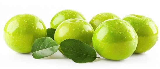 Poster - Fresh green apples with water droplets and green leaves arranged on a white background, showcasing vibrant colors and a polished appearance.