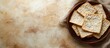 © meristock - Passover matzah flatbread arranged in a woven basket on a soft beige background with subtle texture and warm tones, emphasizing tradition and culture.