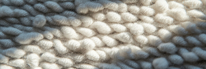Poster - Light gray dense berber carpet showcasing subtle texture and looped pile detail