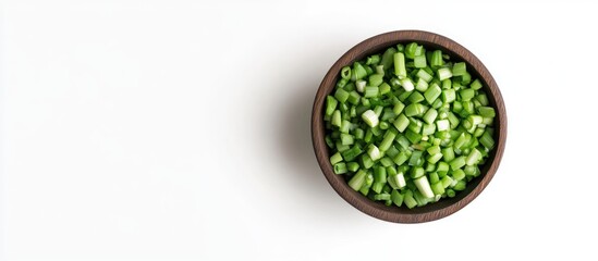 Poster - Chopped green onions in a dark brown wooden bowl positioned centrally on a white background with contrasting vibrant green color scheme.