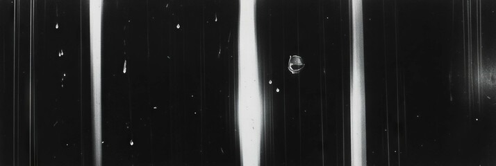 Poster - Film texture featuring deep vertical scratches, grain, and harsh lighting in black and white