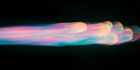 Fototapete - Soft elongated bokeh texture with color gradient over black background