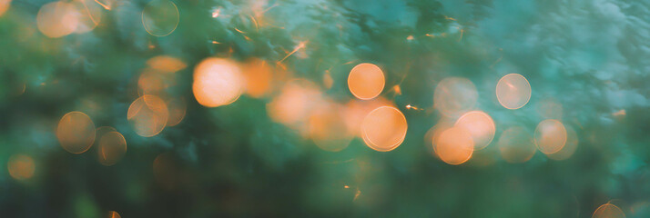 Fototapete - Soft round bokeh texture with warm golden sparkles creating a dreamy atmosphere