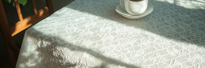 Poster - White embroidered tablecloth with geometric design and delicate stitches in soft light