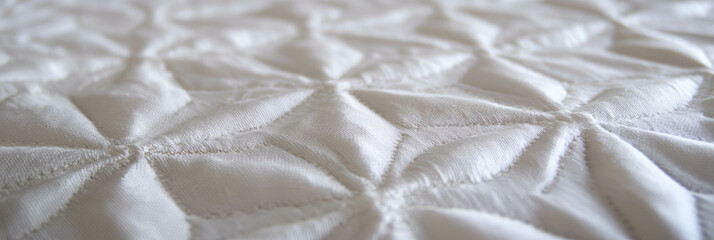 Poster - Elegant white embroidered tablecloth featuring geometric designs and delicate stitching details