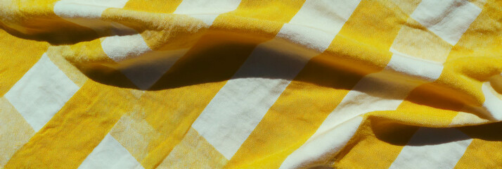 Poster - Crisp texture of yellow gingham tablecloth evokes warmth and charm in any setting