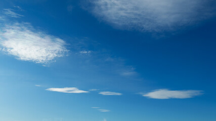Wall Mural - beautiful blue sky with soft white clouds for abstract background