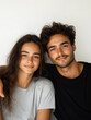 © Roman Stock studio - Happy young couple posing together in casual clothing.